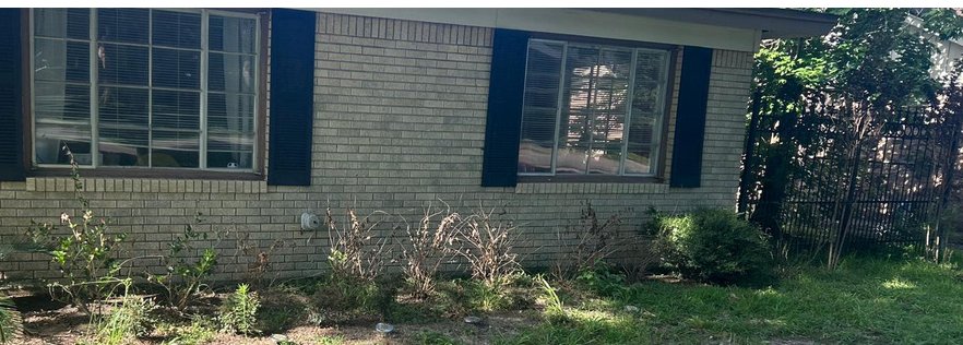 Houston ranch house in dated tan brick before painting