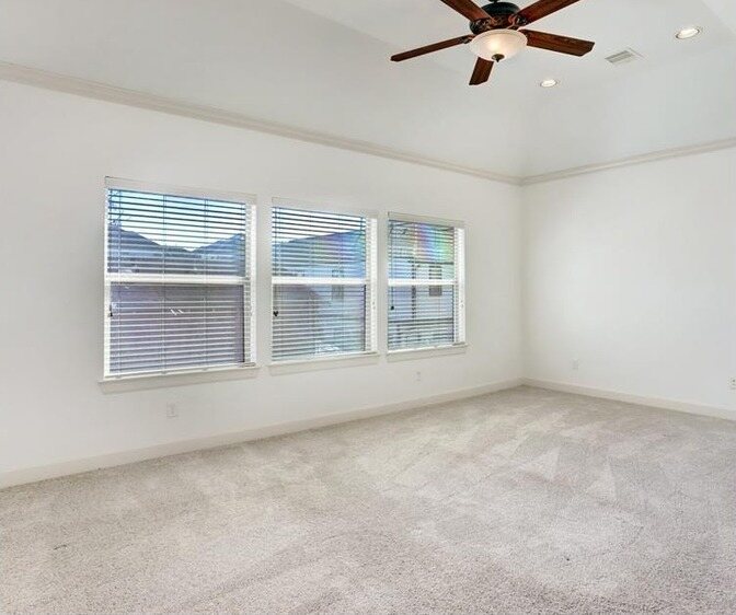 The same bedroom in a soft white with the trim repainted