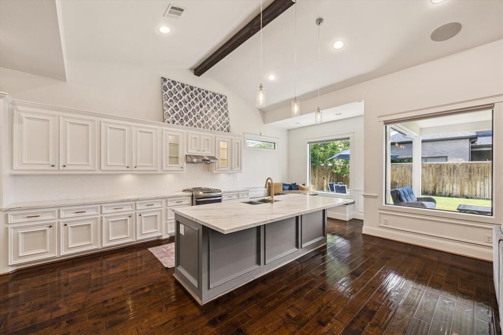 The same kitchen with white quartz counters