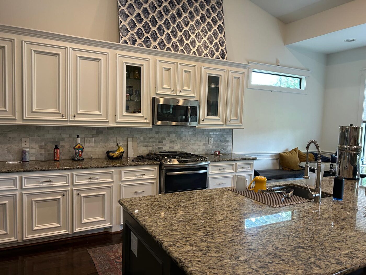 Kitchen with beige granite counters before the work