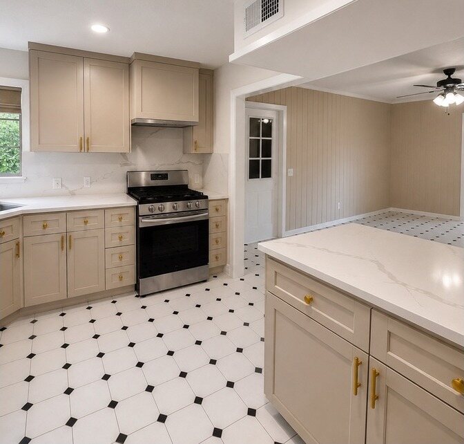 The same space with warm greige cabinetry, quartz counters and gold hardware
