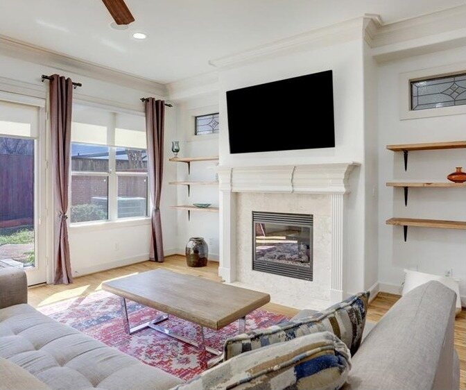 The same living room in white with the trim and fireplace surround to match