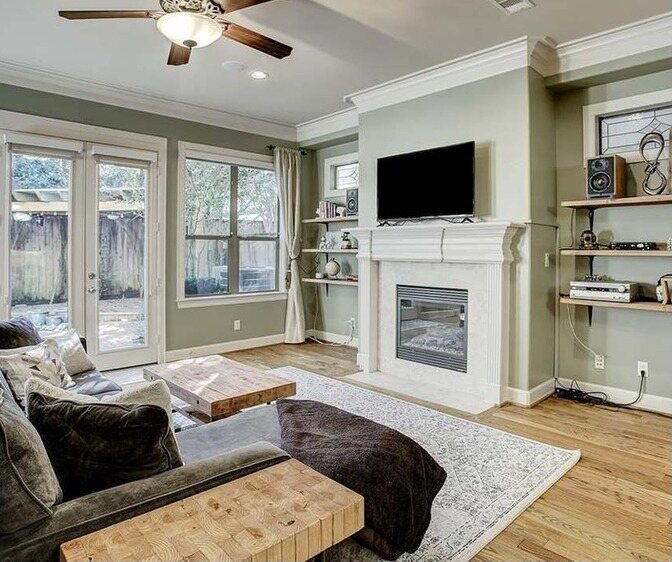 Living room with sage green walls
